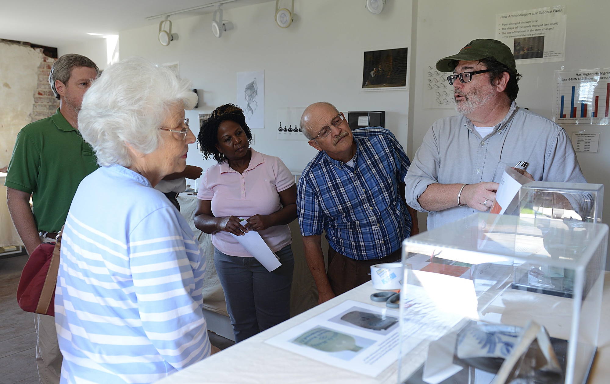 Christopher McDaid, 733rd Civil Engineer Squadron Environmental Element archeologist, explains the history of artifacts on display at the Matthew Jones House during the Archaeology open house at Joint Base Langley-Eustis, Va., Oct. 19, 2016. Built in 1700, the house is the oldest building owned by the Department of Defense in the United States. (U.S. Air Force photo by Staff Sgt. Teresa J. Cleveland)