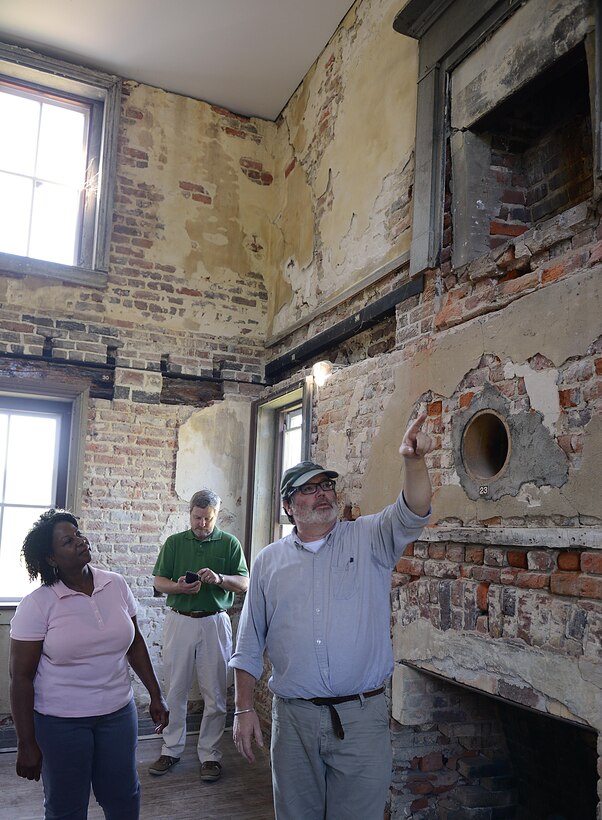 Environmental Element archeologist, points out various recent renovations in brickwork to the Matthew Jones House during the Archaeology open house at Joint Base Langley-Eustis, Va., Oct. 19, 2016. The house serves as an architectural museum, displaying artifacts found on Mulberry Island, the land Fort Eustis, Va. is built on.(U.S. Air Force photo by Staff Sgt. Teresa J. Cleveland)