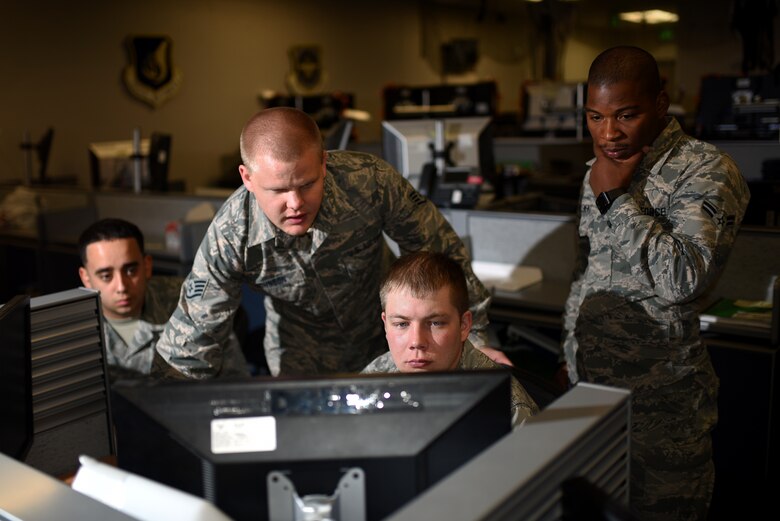 PETERSON AIR FORCE BASE, Colo. – Senior Airman Edward Graham, 561st Network Operations Squadron vulnerabilities remediation operator, works diligently alongside his squadron to scour over 800,000 computers for threats at Peterson Air Force Base, Colo., Oct. 20, 2016. Common threats come from personal external devices such as cell phones and hard drives. Insider threats from disgruntled employees seeking to cause harm are other possible concerns Airmen from the NOS face daily. (U.S. Air Force photo by Airman 1st Class Dennis Hoffman)