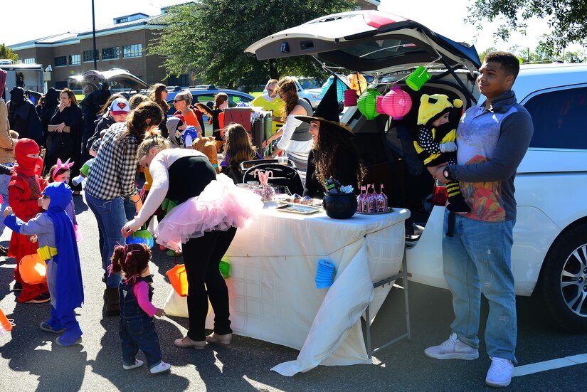 Members of the 36th Intelligence Squadron, are dressed as wizard fantasy themed costumes, hosting games and handing out candy during the Trunk-or-Treat event at Joint Base Langley-Eustis, Va., Oct. 22, 2016. The 36th IS won the “best costume” award and the “best trunk” was the 15th IS. (U.S. Air Force photo by Airman 1st Class Tristan Biese)