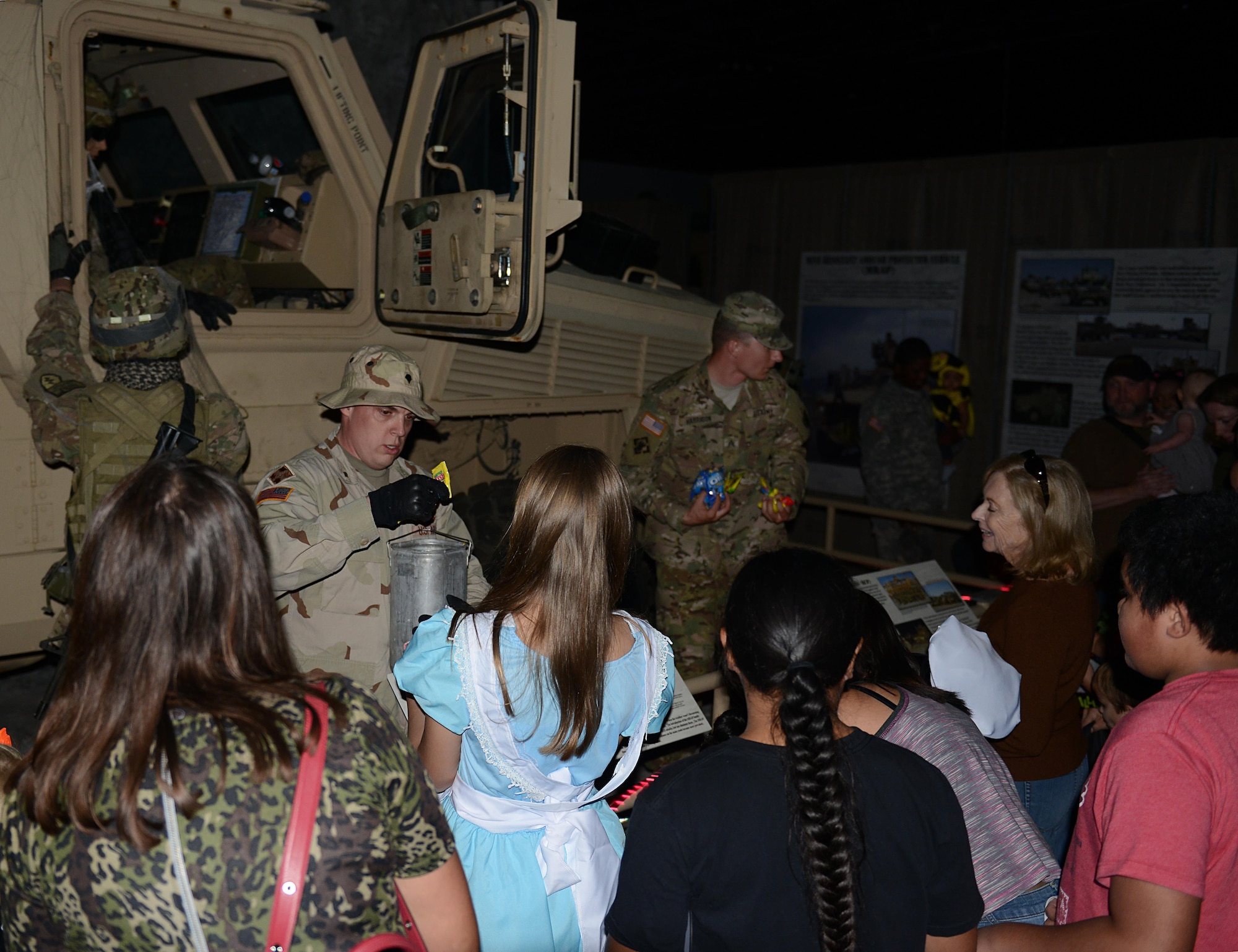 Volunteers posing as mannequins come to life to pass out candy at the annual Night at the Transportation Museum event at Joint Base Langley-Eustis, Va., Oct. 24, 2016. The event was first hosted at the Transportation Museum in 2010, with the help of volunteers and professional actors. (U.S. Air Force photo by Staff Sgt. Teresa J. Cleveland)