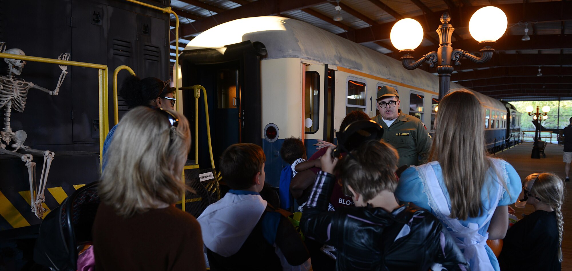 Families prepare to walk through a train car at the Night at the Transportation Museum event at Joint Base Langley-Eustis, Va., Oct. 24, 2016. This is the first year the event featured a walk through a train car in the rail yard. (U.S. Air Force photo by Staff Sgt. Teresa J. Cleveland)