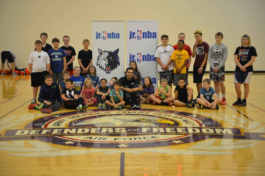 Tyus Jones, Minnesota Timberwolves point guard, poses with participants at the military kids basketball clinic Oct. 22.