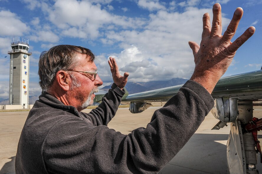 Dan Patterson, a retired Air Force master sergeant and current F-16 aircraft sheet metal mechanic with the Ogden Air Logistics Complex, reminisces about the days he worked on F-4 Phantom II aircraft beginning at 19 years of age. Patterson viewed two QF-4s at Hill Force Base, Oct. 25, during an event celebrating the final days of operational F-4s in the U.S. Air Force. The event – touted as the ‘Phinal Phantom Phlight’ – featured flybys, a luncheon, and static display. (U.S. Air Force photo by Micah Garbarino)