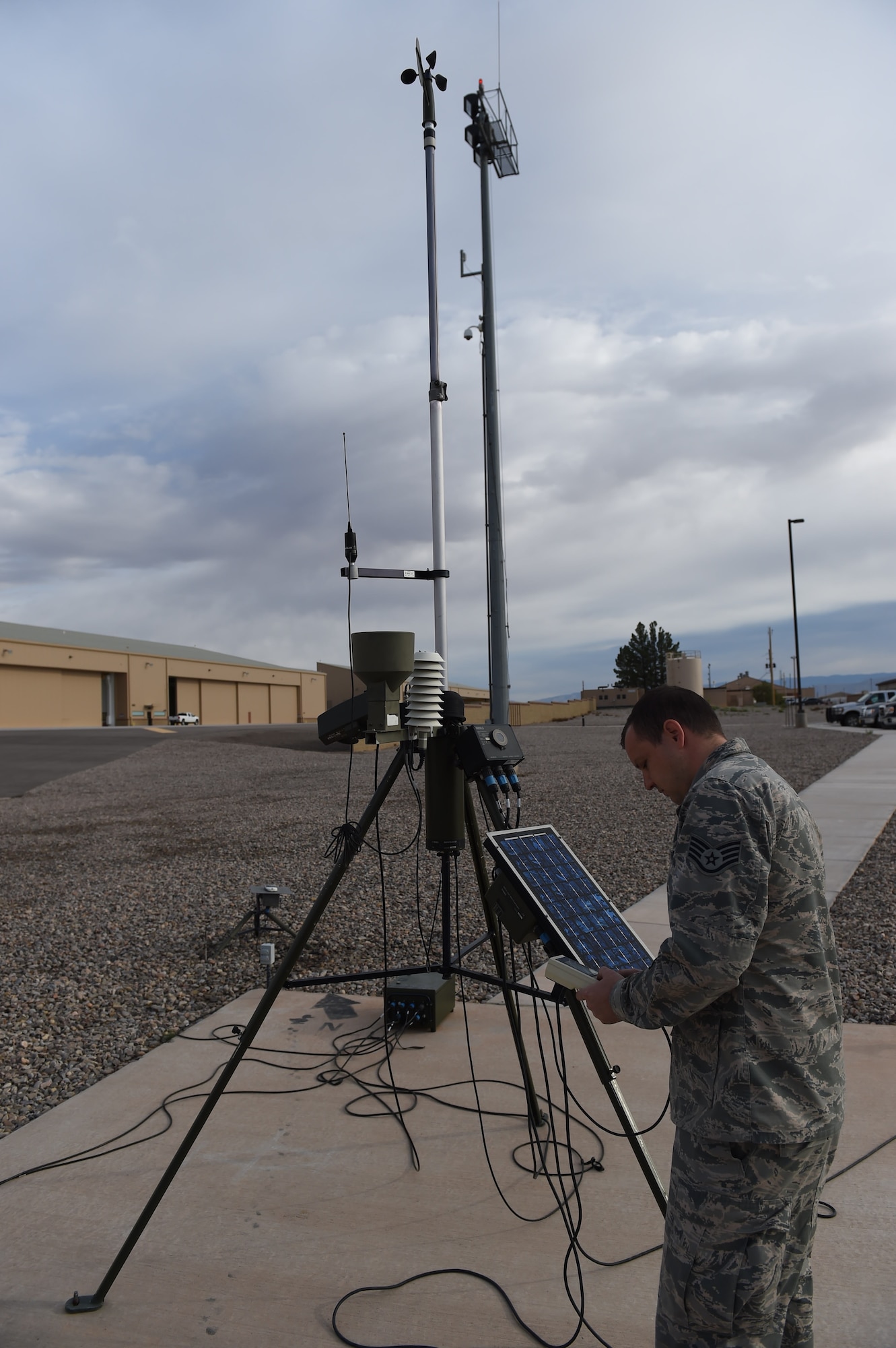 Staff Sgt. Jonathan, a 49th Operations Support Squadron weather forecast technician, conducts a test with the Tactical Meteorological Observation System on Oct. 6, 2016 at Holloman Air Force Base N.M. The system can detect humidity, lightning, wind, visibility, temperature and present weather conditions. (U.S. Air Force photo by Staff Sgt. Warren Spearman)