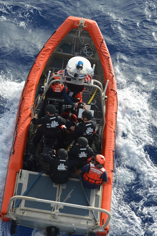 Boarding team members, aboard a cutter boat-small, depart the Coast Guard Cutter Sequoia en route to a fishing vessel in the Pacific Ocean in order to conduct an at-sea boarding. The Sequoia crew recently returned from a 30-day deployment to promote regulatory compliance of the $7 billion tuna fishing industry in remote areas within Oceania. (U.S. Coast Guard Photo by Petty Officer 2nd Class Melissa McKenzie)