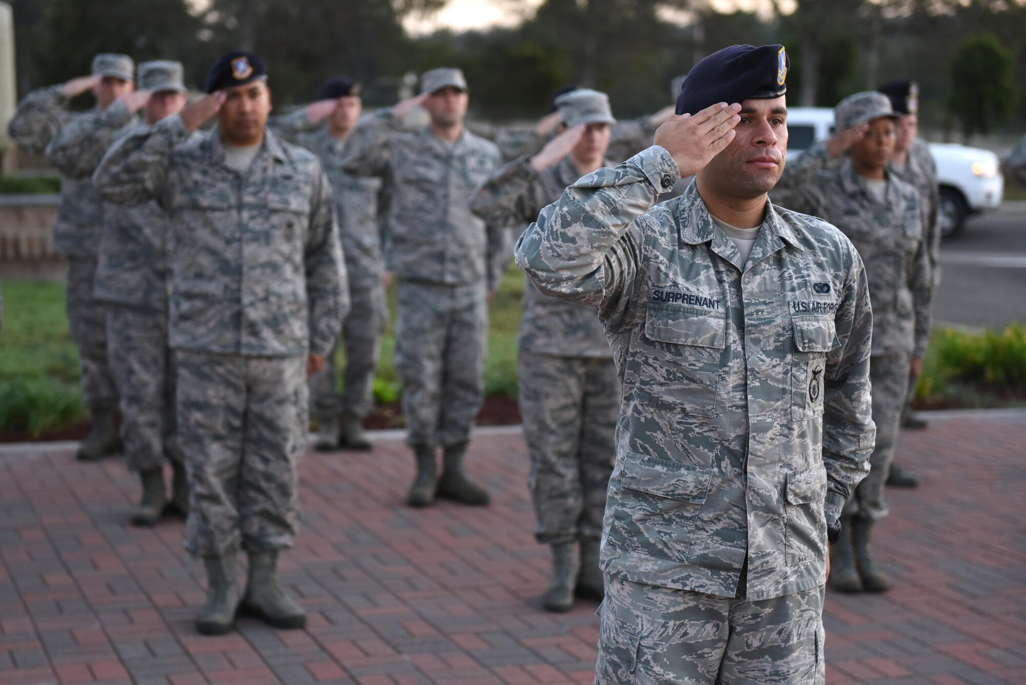 Members of Airman Leadership School Class 17-Alpha salute during Reveille, Oct. 25, 2016, Vandenberg Air Force Base, Calif. During their time in ALS, students embark on a 192-hour, 24-day journey designed to develop leadership abilities, the profession of arms, and effective communication. (U.S. Air Force photo by Airman 1st Class Robert J. Volio/Released)
