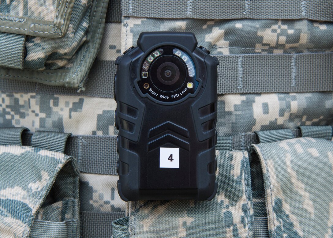 A single body worn camera rests on an 11th Security Forces Squadron officer’s flak vest at Joint Base Andrews, Md., Oct. 4, 2016. These devices were implemented Oct. 26 as part of an Air Force-level test to determine which kind of camera will best suit the service’s defenders and their procedures. (U.S. Air Force photo by Senior Airman Jordyn Fetter)