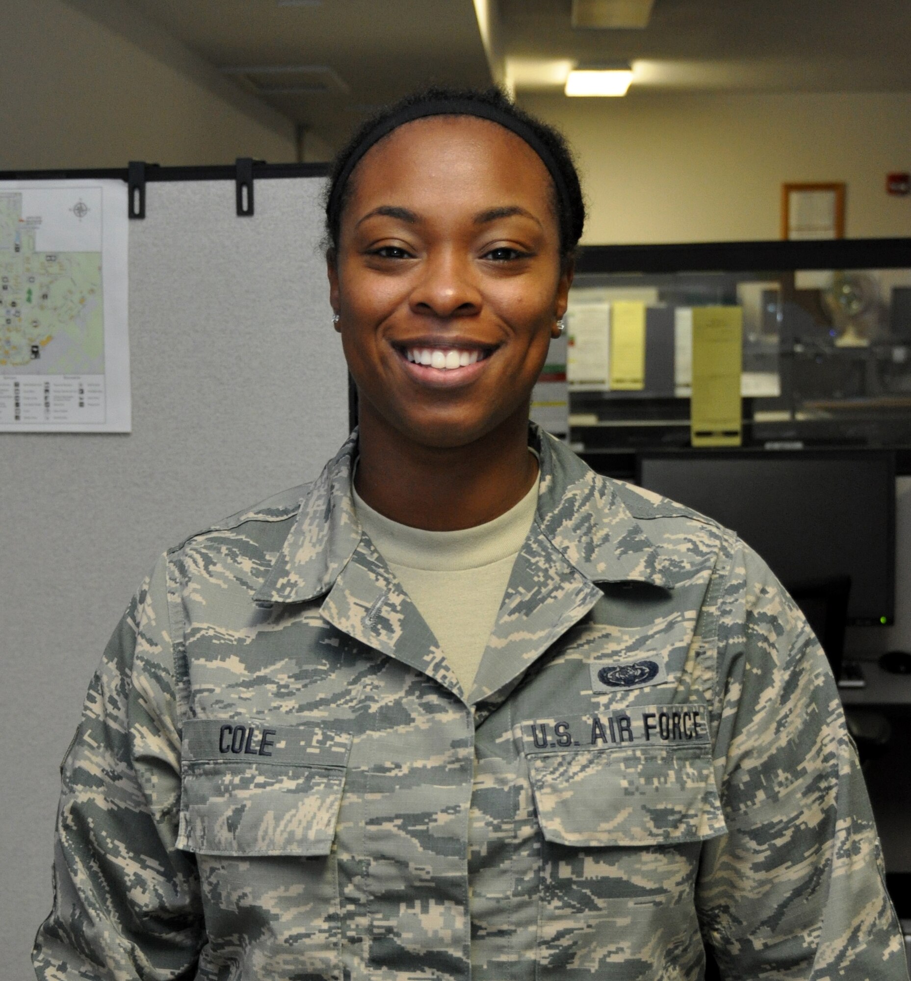 Senior Airman Genesis Cole, 349th Force Support Squadron client systems technician, is ready to help others during a Unit Training Assembly, October 16, 2016. Cole was also recently awarded the John L. Levitow Award at the Airman Leadership School in Sheppard Air Force Base, Texas, on September 29, 2016. It is the top award for ALS graduates and is earned through excellence in academics and leadership. (U.S. Air Force photo/Tech. Sgt. Cindy G. Alejandrez)