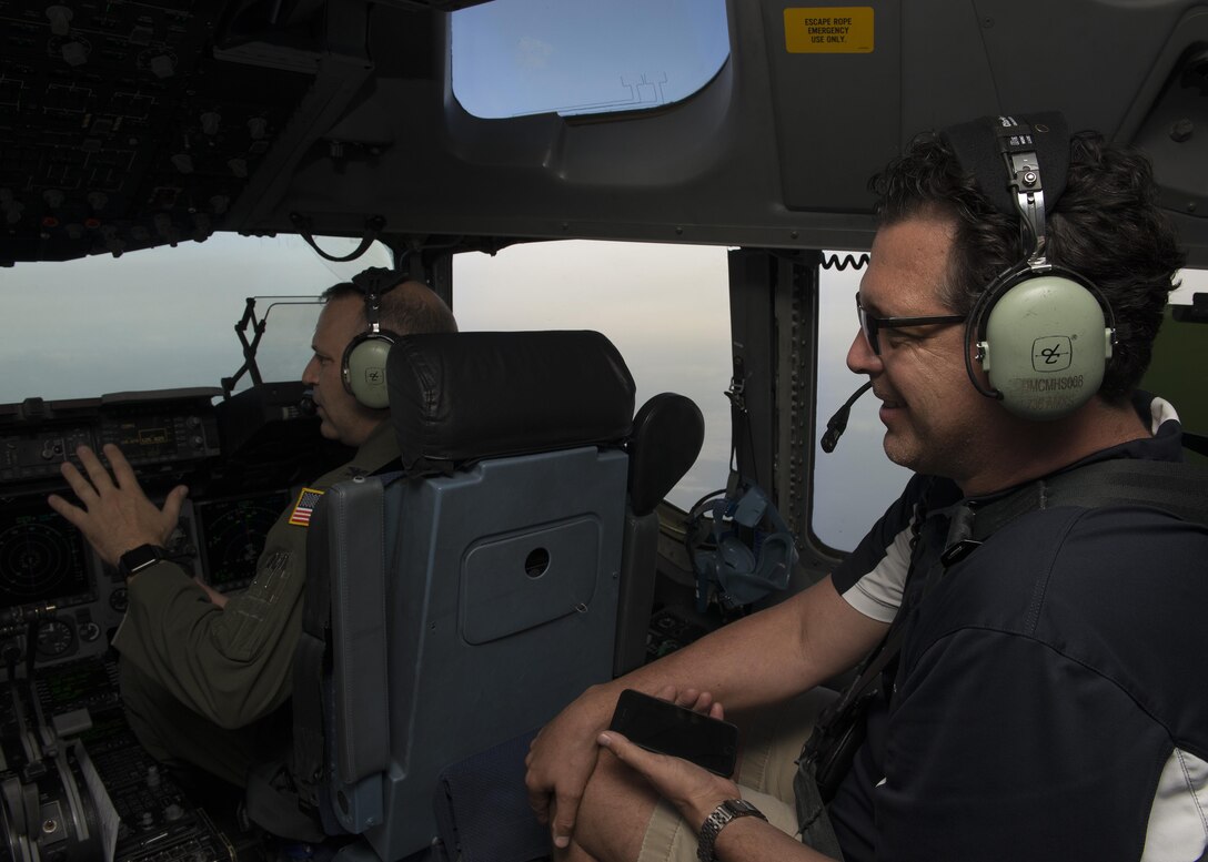 Todd Ewald, 436th Aircraft Maintenance Squadron honorary commander, converses with Col. Doug Hall, 436th Operations Group commander, during a community relations tour Oct. 20, 2016, inside a C-17A Globemaster III, en route to Dover Air Force Base, Del. This C-17, operated by the 3d Airlift Squadron, transport the CRT to the three bases. (U.S. Air Force photo by Senior Airman Zachary Cacicia)