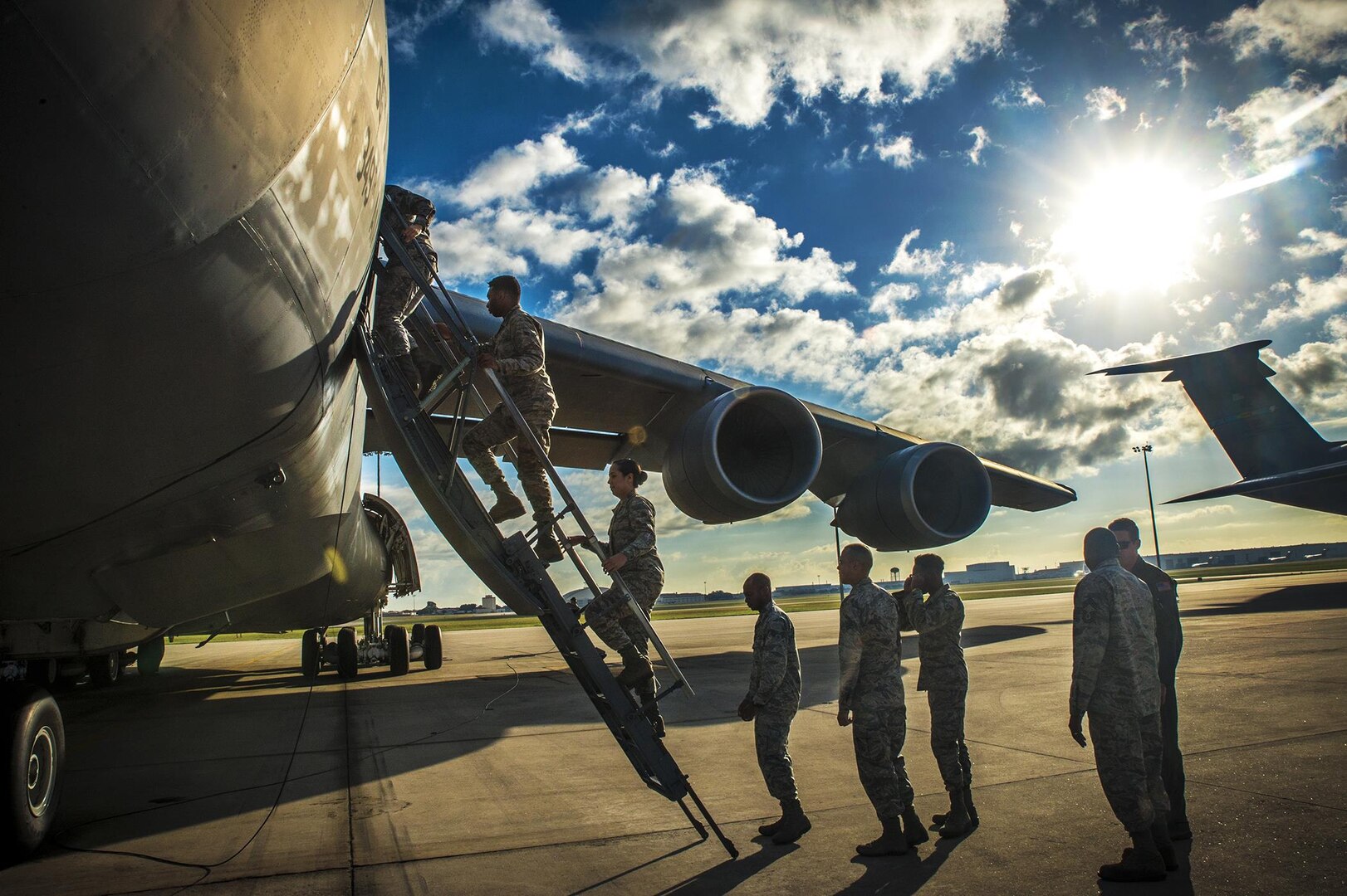 Airmen with the 59th Medical Support Squadron climb into a C-5M Super Galaxy aircraft Oct. 26, 2016 at Joint Base San Antonio-Lackland, Texas. In addition to boarding the Air Force's largest aircraft, the Airman toured the formal training unit for all C-5M Super Galaxy aircrew training. (U.S. Air Force photo by Benjamin Faske)
