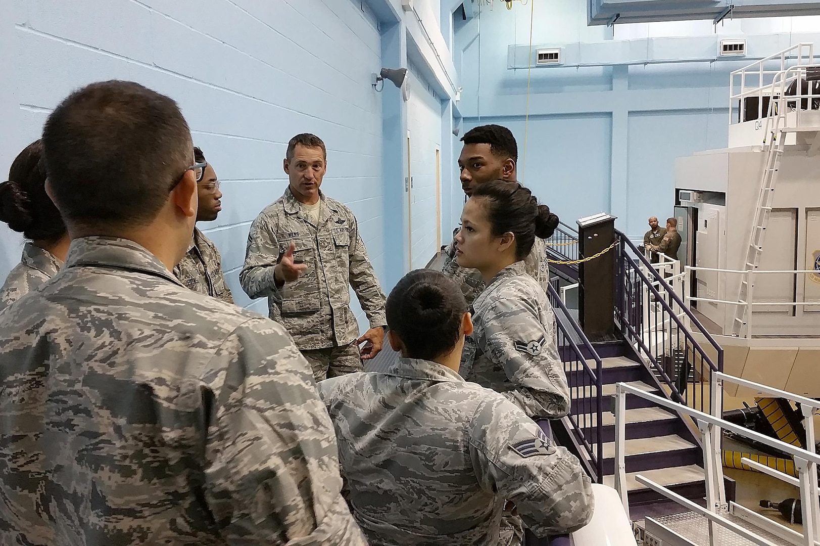 Senior Master Sgt. Thomas Wilks, 733rd Training Squadron superintendent, gives a C-5M simulator tour to Airmen with the 59th Medical Support Squadron Oct. 26, 2016 at Joint Base San Antonio-Lackland, Texas. The Airmen also toured a C-5M Super Galaxy aircraft on the 433rd Airlift Wing flight line. (U.S. Air Force photo by Benjamin Faske)