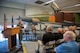 Gen. “Hawk” Carlisle, commander of Air Combat Command gives a speech during a dedication ceremony at the Threat Training Facility on Nellis Air Force Base, Nev., Oct. 17. During the ceremony, a MiG-23 was dedicated to honor his role in the CONSTANT PEG program. The mission of CONSTANT PEG was to train U.S. Air Force, U.S. Navy and U.S. Marine Corps combat fighter aircrews on the best ways to fight and win when encountering MiG built aircraft in aerial combat. Carlisle was the chief of weapons and tactics as well as flight commander for the 4477th Test and Evaluation Squadron from 1986 to 1988.