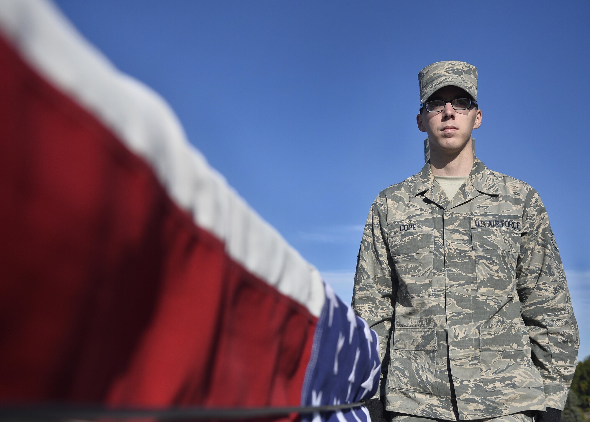 Senior Airman Alec B. Cope, a ceremonial guardsman for the Patriot Honor Guard, participates in a funeral honors training exercise at Hanscom Air Force Base, Mass., Oct. 20. Cope, and other members of the Patriot Honor Guard team, provide military funeral honors throughout New England and parts of New York for active duty, retired members and veterans who served in the United States Air Force honorably. (U.S. Air Force photo by Mark Wyatt)