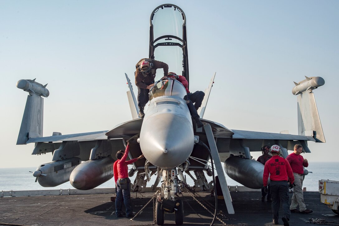 Sailors conduct pre-flight inspections on an E/A-18G Growler assigned to Electronic Attack Squadron 130 on the flight deck of the aircraft carrier USS Dwight D. Eisenhower in the Persian Gulf, Oct. 18, 2016. Ike and its Carrier Strike Group are deployed in support of Operation Inherent Resolve, maritime security operations and theater security cooperation efforts in the U.S. 5th Fleet area of operations. Navy photo by Petty Officer 3rd Class Robert J. Baldock