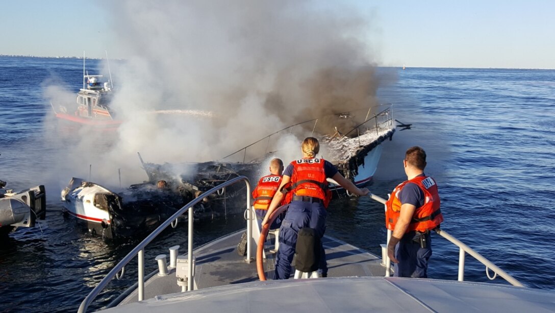 A Coast Guard Station Sandy Hook boat crew and New York Fire Department Marine eight rescue crew responded to a boat fire near Sandy Hook, New Jersey. Coast Guard and FDNY crews arrived on scene where a good Samaritan had safely transferred eight people off the vessel in distress. (U.S. Coast Guard photo by Station Sandy Hook.) 