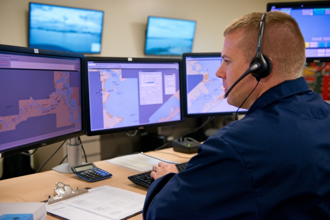 A Chief Petty Officer speaks to local mariners requesting navigational assistance, at Sector Houston-Galveston. The Coast Guard provides these services in major ports throughout the United States as a way of communicating to various mariners about port conditions that would affect safe transit in and out of ports and waterways. (U.S. Coast Guard photo by Petty Officer 3rd Class Jennifer A. Nease)