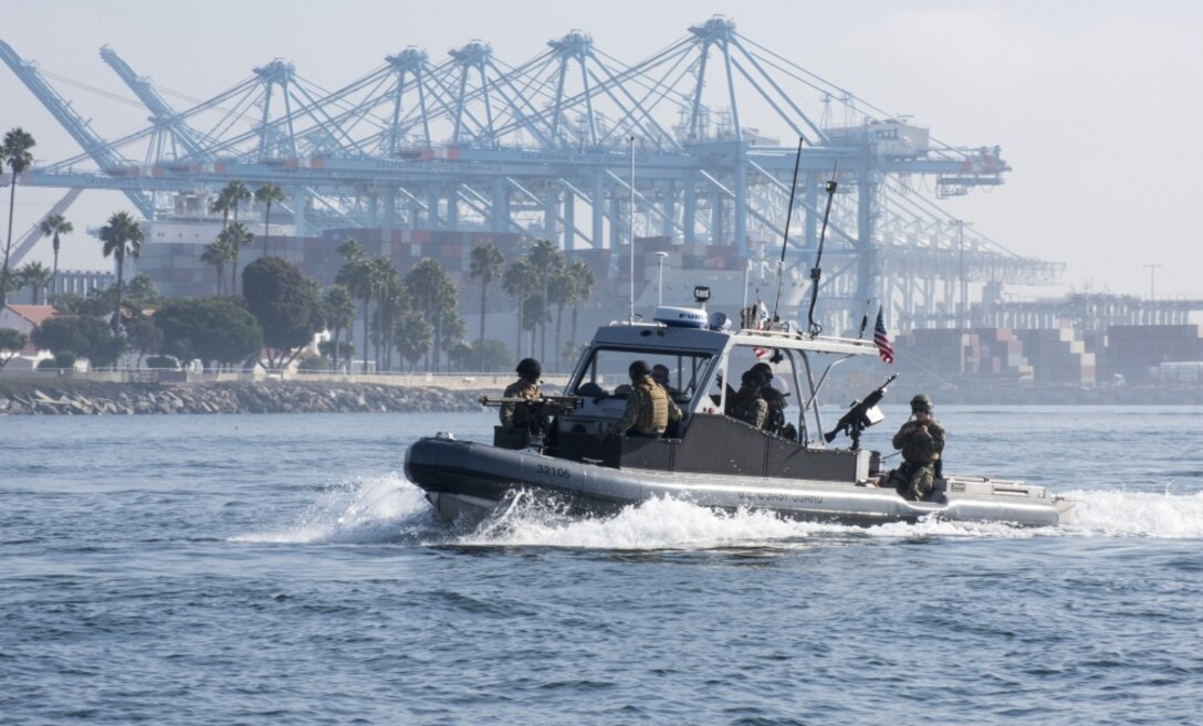 Members of Coast Guard Port Security Unit 311 based in San Pedro, California conduct a military training exercise in the Port of Los Angeles. The training exercise is designed to test and maintain the proficiency of the unit’s reserve and active duty members. During the drill members were required to conduct high speed small boat maneuvers and simulated automatic weapon fire. (U.S. Coast Guard photo by Petty Officer 3rd Class Andrea Anderson)