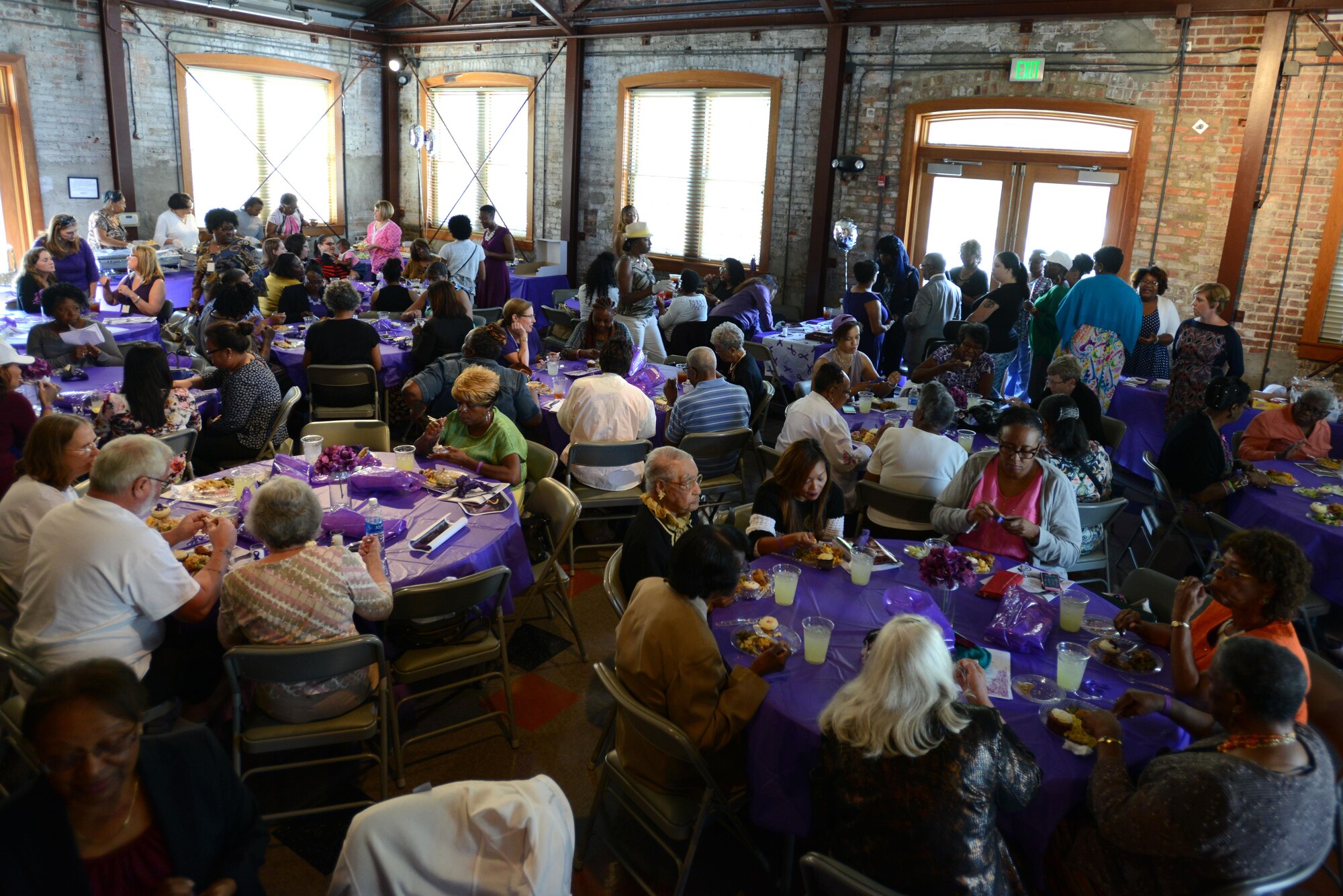 Members of the Sumter and Shaw Air Force Base communities attend a Domestic Violence Survivor’s Luncheon at the James Clyburn Intermodal Transportation Center pavilion, Sumter, S.C., Oct. 20, 2016. The luncheon included food, speeches by survivors of domestic violence, and giveaways. (U.S. Air Force photo by Airman 1st Class Kelsey Tucker)