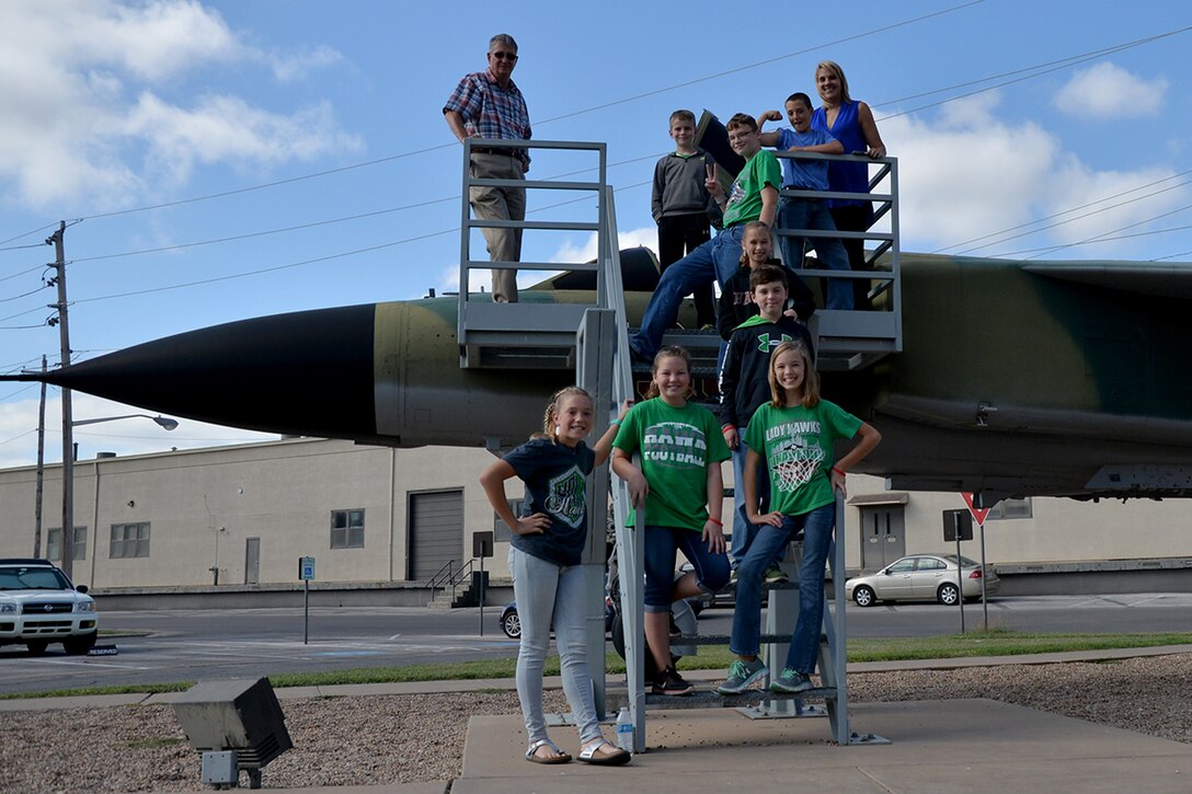 Wall Middle School students stand on a static display of a Russian MiG-23 Flogger during a tour on Goodfellow Air Force Base, Texas, Oct. 24, 2016. Students viewed fire trucks, trainer jets and equipment used to anaylze earthquakes. (U.S. Air Force photo by Airman 1st Class Randall Moose)