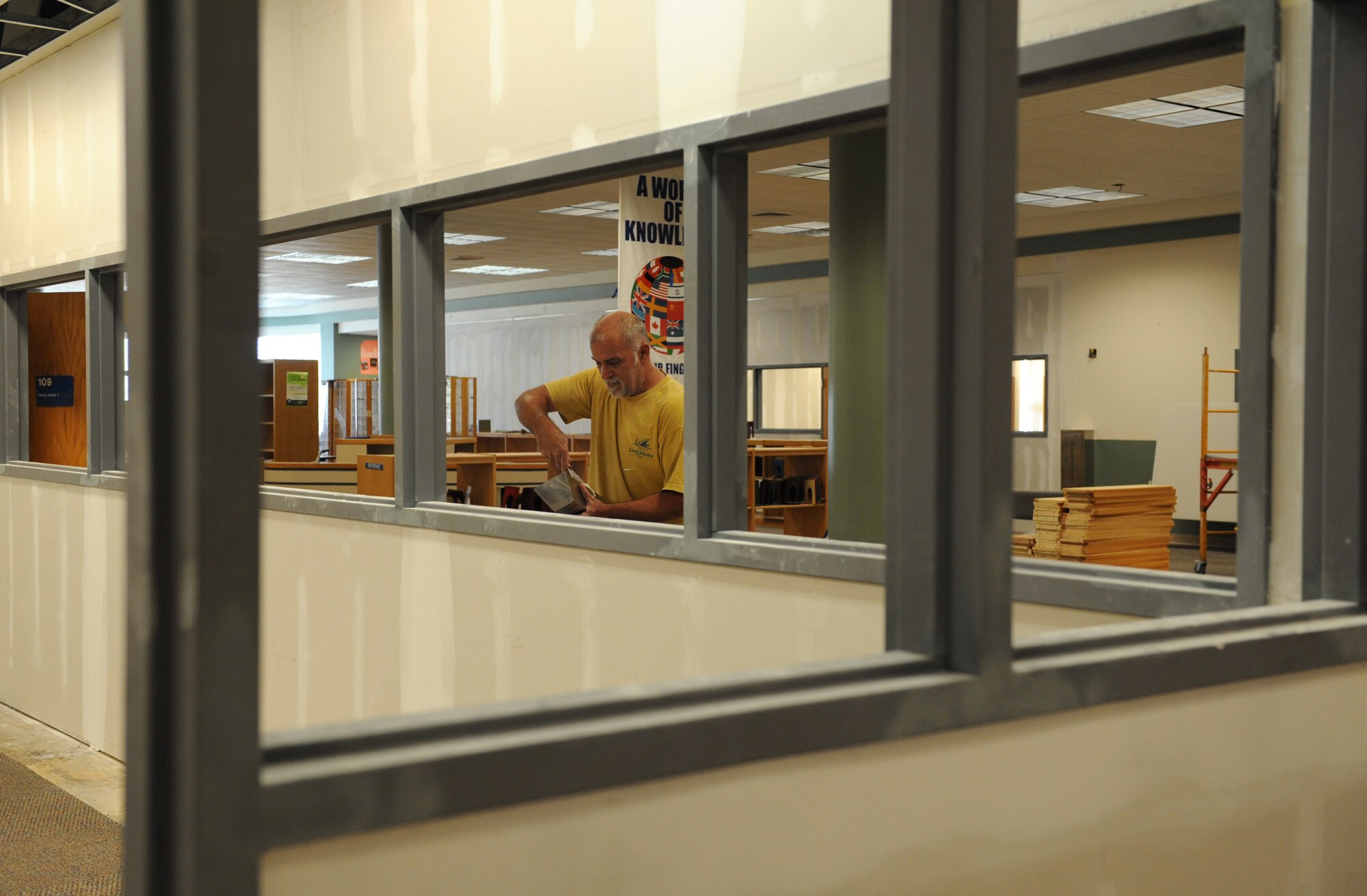 Lonnie Owens, DNP Inc. finisher, applies sheetrock finishing to newly built walls at the McBride Commons Oct. 24, 2016, on Keesler Air Force Base, Miss. The renovation project will transition the former base library into a common area housing a children’s library, computer stations, engraving, framing, marketing and print shops and a full kitchen. The nine-month project is expected to be complete by May 2017. (U.S. Air Force photo by Kemberly Groue/Released) 