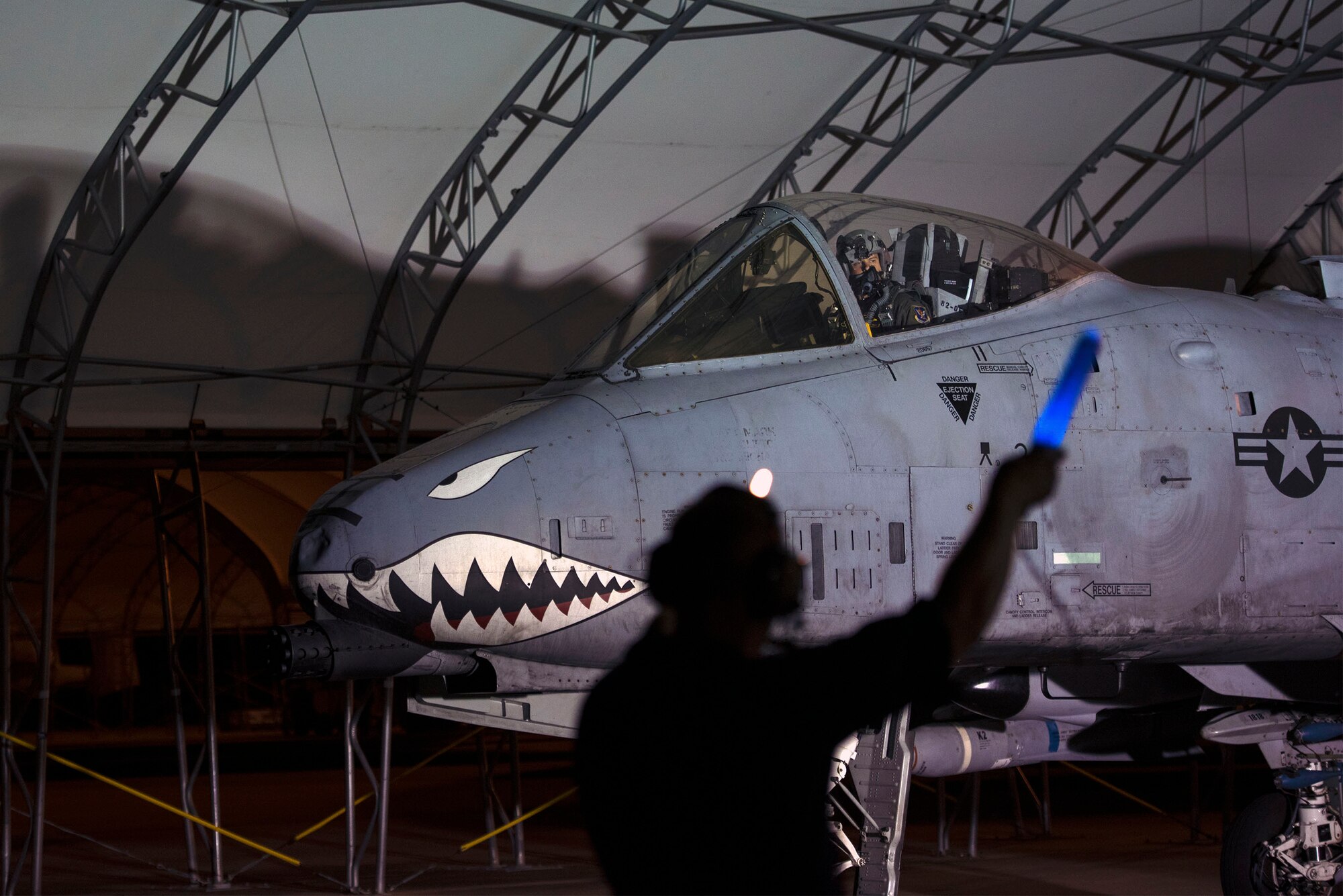 Senior Airman Eric Hinton, 74th Aircraft Maintenance Unit dedicated crew chief, marshals Capt. Cale Lamoreux, 74th Fighter Squadron A-10C Thunderbolt II pilot, to take-off for night operational flight training, Oct. 20, 2016, at Moody Air Force Base, Ga. Pilots from the 74th FS are tasked with to carrying out the A-10’s mission, which is designed to accurately deliver weapons in low altitudes while providing close-air support. (U.S. Air Force photo by Airman 1st Class Greg Nash)