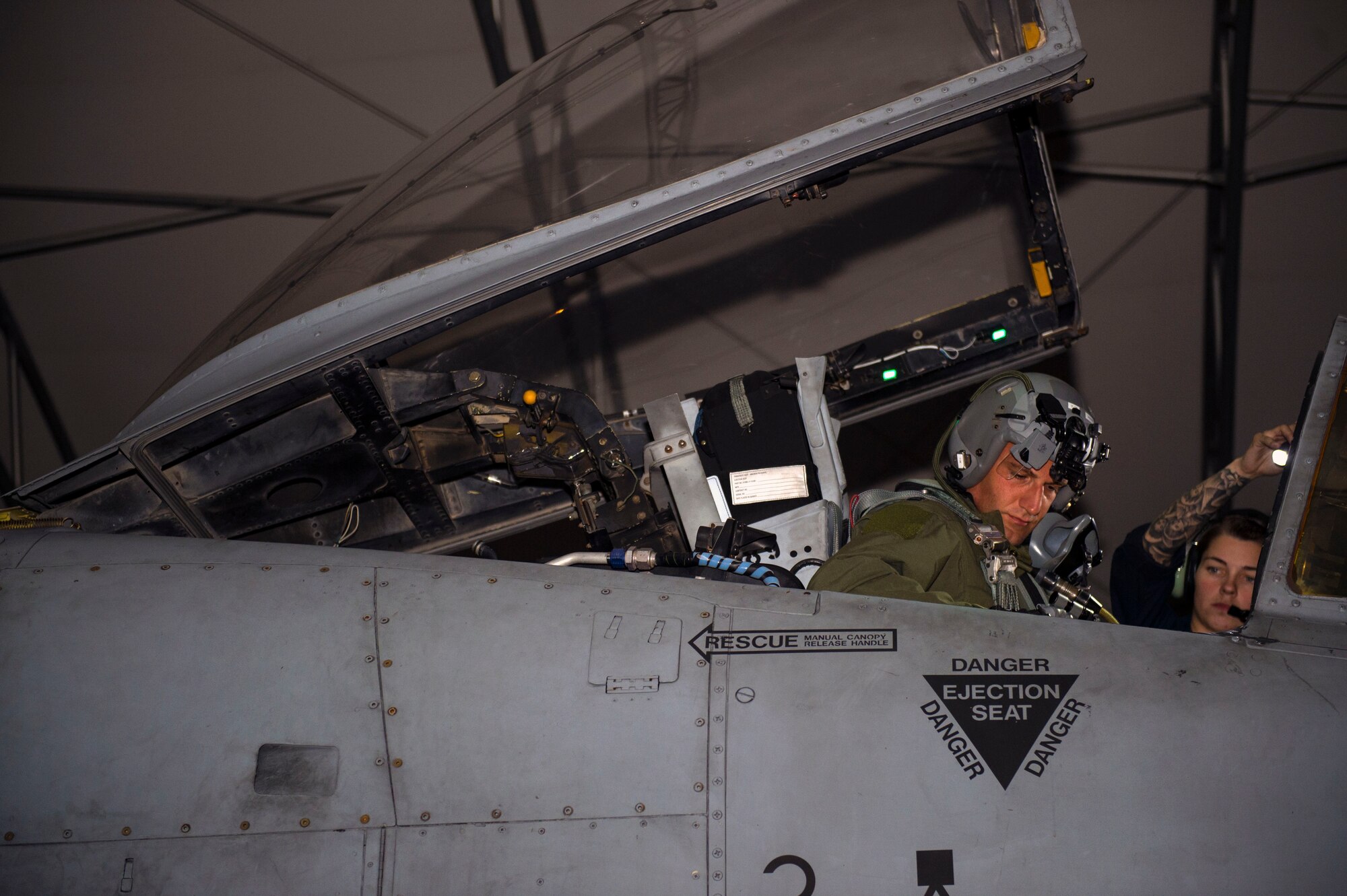 Capt. Roberto Manzo, 74th Fighter Squadron A-10C Thunderbolt II pilot, inspects the cockpit of an A-10 with the assistance of Staff Sgt. Alexandria Ketterhagen, 74th Aircraft Maintenance Unit dedicated crew chief, during night operational flight training, Oct. 25, 2016, at Moody Air Force Base, Ga. Ketterhagen was responsible for supervising and assisting Manzo to ensure that the A-10’s components were optimally performing. (U.S. Air Force photo by Airman 1st Class Greg Nash)