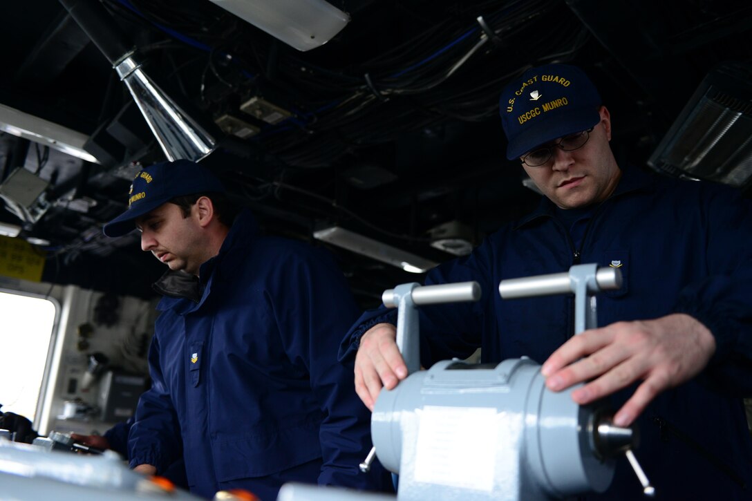 Crewmembers of Coast Guard Cutter Munro, a 378-foot High Endurance Cutter
homeported in Kodiak, Alaska, execute propulsion commands given by the
cutter's acting conning officer as the cutter transits through Hiram M.
Chittenden Locks in Seattle. The cutter entered Lake Union for a scheduled
dry dock maintenance, which is the last scheduled dry dock for any 378-foot
cutter in the Coast Guard fleet before the ships are decommissioned. U.S.
Coast Guard photo by Seaman Sarah Wilson.
