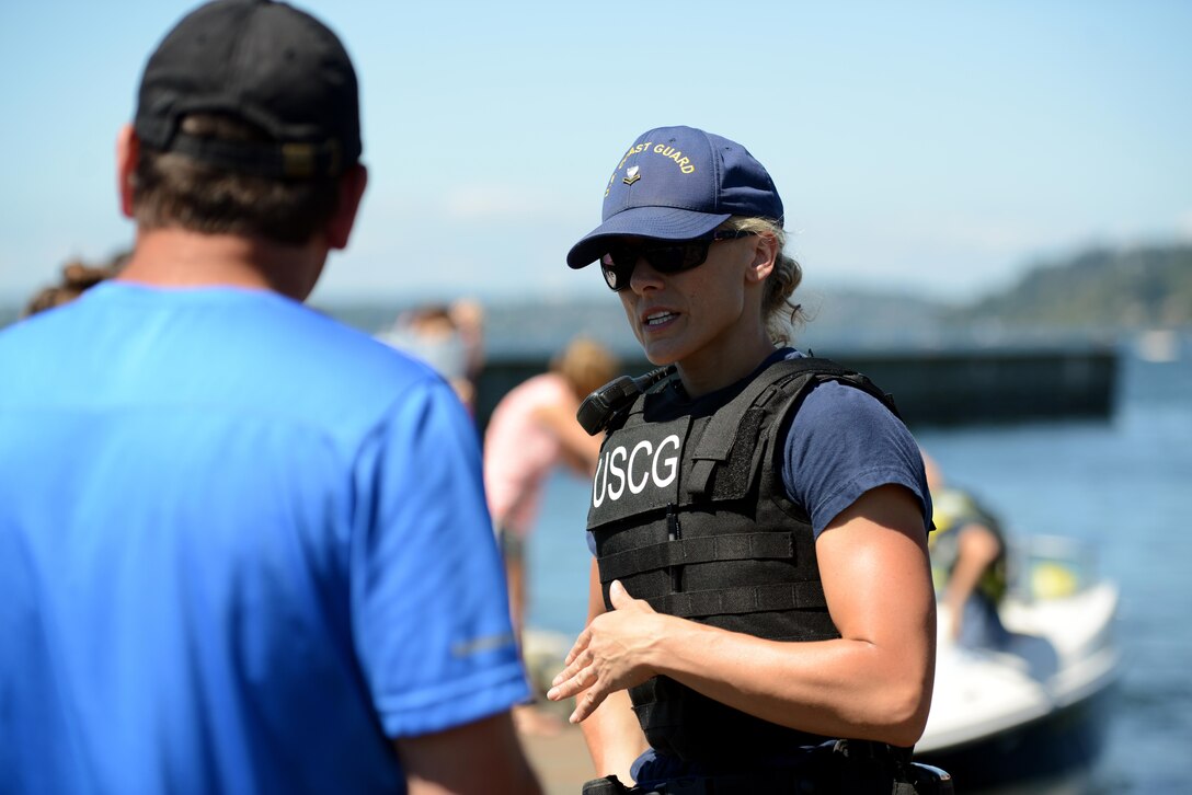 A Second Class Maritime Enforcement Specialist from Coast Guard Sector Puget Sound's Sector Boarding Team, speaks with local boaters about
proper safety equipment during an inspection at Gene Coulon Park in Seattle.
Seafair is an annual event that celebrates summer in the Pacific Northwest.
U.S. Coast Guard photo by Petty Officer 1st Class Zac Crawford.
