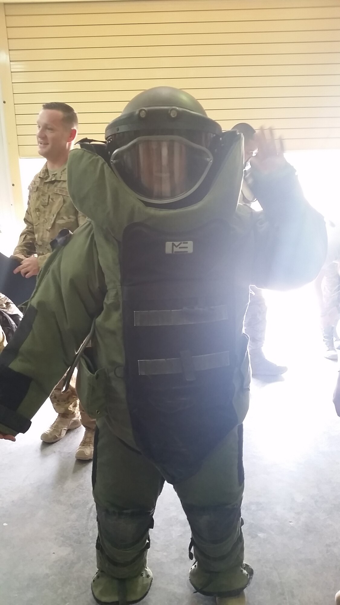 Cadet 2nd Class Susan Kwon, a geospatial science major at the U.S. Air Force Academy, tries on a bomb suit at an Air Base in the Middle East this summer. Kwon's trip to the base was part of the Academy's Deployed Operations Program, which sends sophomore and junior cadets to overseas units to see how Airmen complete the Air Force mission. (Courtesy photo) 