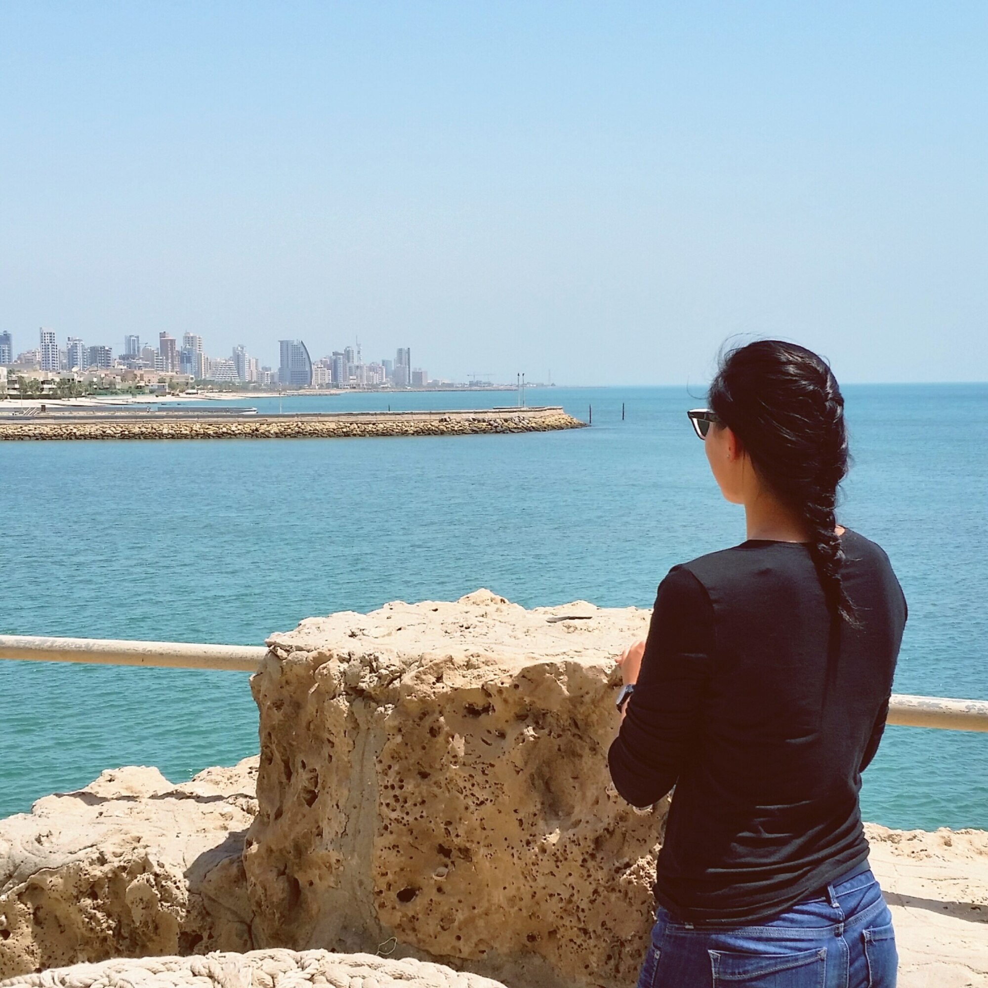 Cadet 2nd Class Susan Kwon, a geospatial science major at the U.S. Air Force Academy, takes a summertime look across the waters of the Persian Gulf. Kwon took part in the Academy's Deployed Operations program, which sends sophomore and junior cadets to overseas units to see how Airmen complete the Air Force mission.(Courtesy photo)