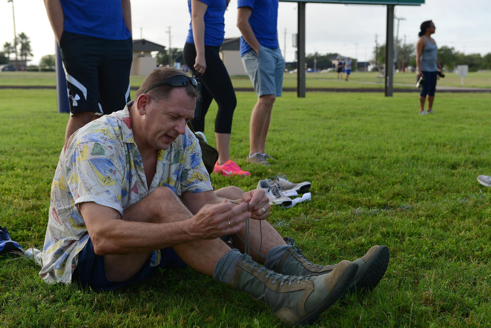 Col. Brian Hinsvark, 47th Mission Support Group commander, laces up his boots for the ruck portion of Laughlin’s Wingman Challenge on Laughlin Air Force Base, Texas, Oct. 15, 2016. After completing a 5k run, Hinsvark and his wingman Col. Thatcher Cardon, 47th Medical Group commander, rucked an additional 5k with various exercises throughout. (U.S. Air Force photo/Airman 1st Class Benjamin N. Valmoja)