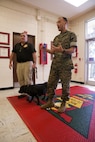 U.S. Marine Corps military working dog, Patti is presented a U.S. Military Working Dog Services Award during an award ceremony in her honor on Marine Corps Air Station Futenma, Okinawa, Japan, Oct. 24, 2016. During her deployment, Patti served as a combat tracking dog, and suffered grave injuries in the line of duty. (U.S Marine Corps photo by Cpl. Janessa Pon)