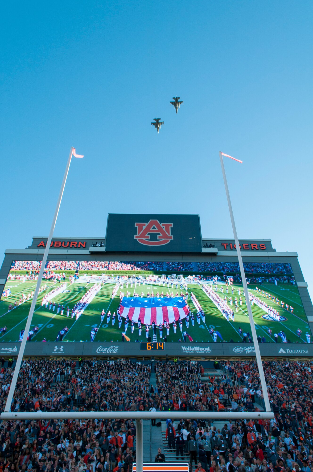 Two F-16 Fighting Falcon aircraft from the 187th Fighter Wing in Montgomery, Ala. perform the pregame flyover of the Auburn/Arkansas football game, October 22, 2016 at Jordan-Hare Stadium in Auburn, Ala. Auburn went on to win the football game 56-3. (US Air National Guard photo by Staff Sgt. Jared Rand)