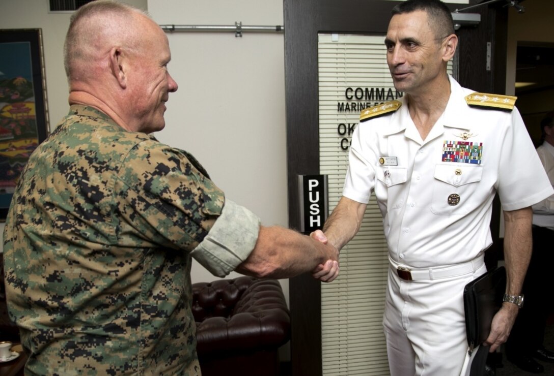 U.S. Navy Rear Admiral Matthew J. Carter, Commander of U.S. Naval Forces Japan, meets with U.S. Marine Corps Lt. Gen. Lawrence D. Nicholson, III Marine Expeditionary Force Commanding General and Okinawa Area Coordinator, during his visit to Okinawa, Japan, Oct. 26, 2016. Rear Adm. Carter led a two-day engagement with local leaders, ending his tour with Lt. Gen. Nicholson to discuss the U.S. military's relationship with Okinawa. (U.S. Marine Corps photo by Cpl. Brittany James)