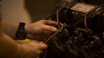 Cpl. Matthew A. Long turns a wrench on a High Mobility Multipurpose Wheeled Vehicle engine on Camp Kinser, Okinawa, Japan, October 25, 2016. Long was selected as a winner in a Marine Corps logistical innovation competition for incorporating a blood clotting agent and pain killer with a Small Arms Protective Insert to minimize the time between injury and aid. Long, from Moultrie, Georgia, is a motor transport mechanic with Motor Transport Company, Maintenance Battalion, Combat Logistics Regiment 35, 3rd Marine Logistics Group, III Marine Expeditionary Force. 