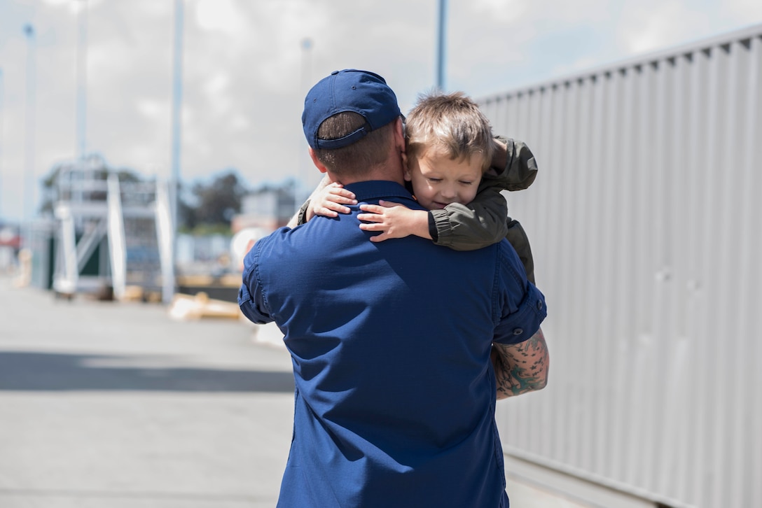 Petty Officer 3rd Class, a maritime enforcement specialist aboard the Coast
Guard Cutter Bertholf, embraces his son after returning from a 95-day
deployment in the Eastern Pacific. The 126-person Alameda-based crew of
Coast Guard Cutter Bertholf interdicted nine smuggling vessels, detained 22
suspected narcotraffickers, and seized over 20,000 pounds of illegal
narcotics while deployed. Coast Guard photo by Petty Officer 3rd Class
Loumania Stewart
