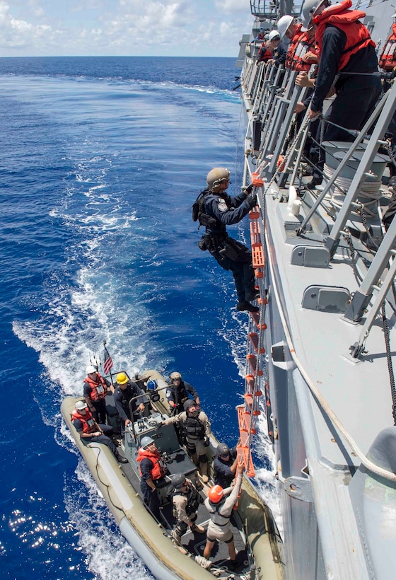 U.S. Coast Guardsmen from Coast Guard Pacific Tactical Law Enforcement Team
(PACTACLET), Law Enforcement Detachment (LEDET) 108 and Sailors assigned to
the guided-missile destroyer USS Spruance (DDG 111) debark a rigid-hull
inflatable boat after conducting a boarding and inspection of a foreign
fishing vessel as part of Oceania Maritime Security Initiative (OMSI).
Spruance, along with the guided-missile destroyers USS Momsen (DDG 92) and
USS Decatur (DDG 73), and embarked "Devil Fish" and "Warbirds" detachments
of Helicopter Maritime Strike Squadron (HSM) 49, are deployed as part of a
U.S. 3rd Fleet Pacific Surface Action Group (PAC SAG) under Destroyer
Squadron (CDS) 31. (U.S. Navy photo by Mass Communication Specialist 2nd
Class Will Gaskill/Released)