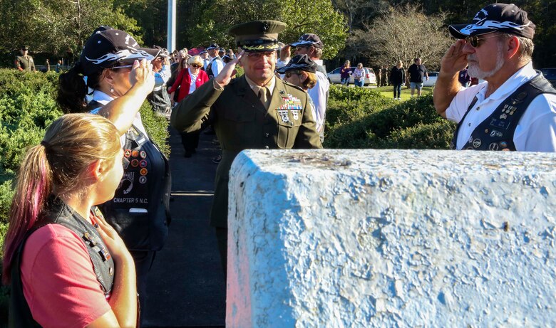 Col. Steven Wolf, commanding officer of the School of Infantry East, salutes pays respects to fallen 1st battalion, 8th Marines of the Beirut Bombing during a wreath laying ceremony at Camp Geiger on Marine Corps Air Station New River, Oct. 23. The ceremony is one of three memorial ceremonies conducted in the Marine Corps Base Camp Lejeune area every year to memorialize the fallen Marines from 1st Battalion, 8th Marines.