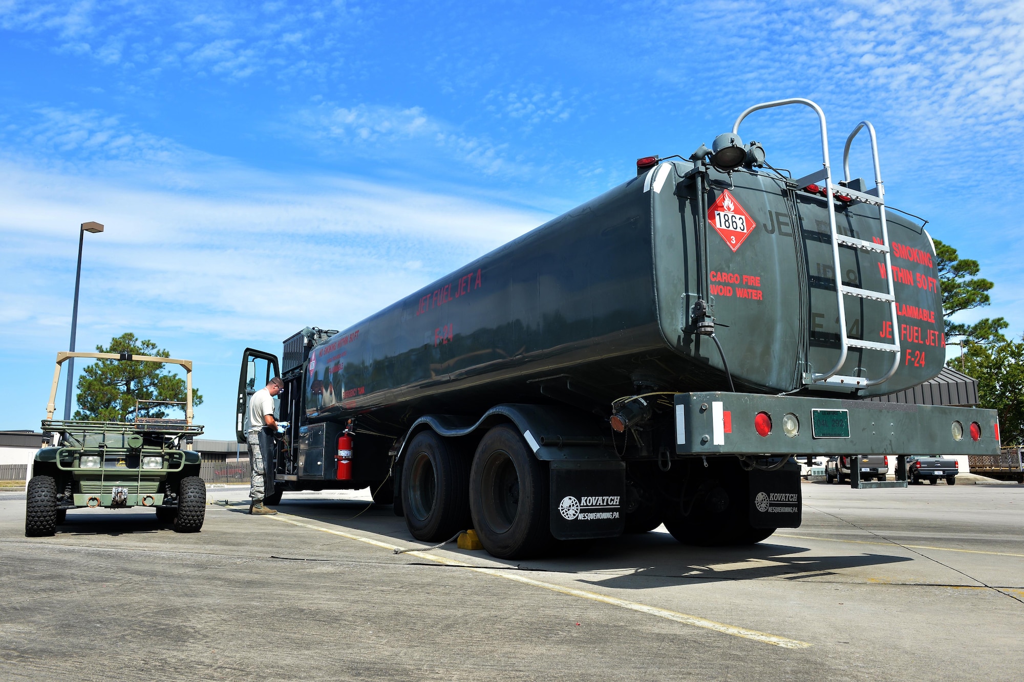 Staff Sgt. Timothy Andrews, NCO in charge of the fuels lab for the 1st Special Operations Logistics Readiness Squadron, collects fuel samples for testing at Hurlburt Field, Fla., Oct. 25, 2016. Fuel specialists test petroleum from fuel trucks monthly to ensure aircraft are provided clean gas. (U.S. Air Force photo by Senior Airman Andrea Posey)