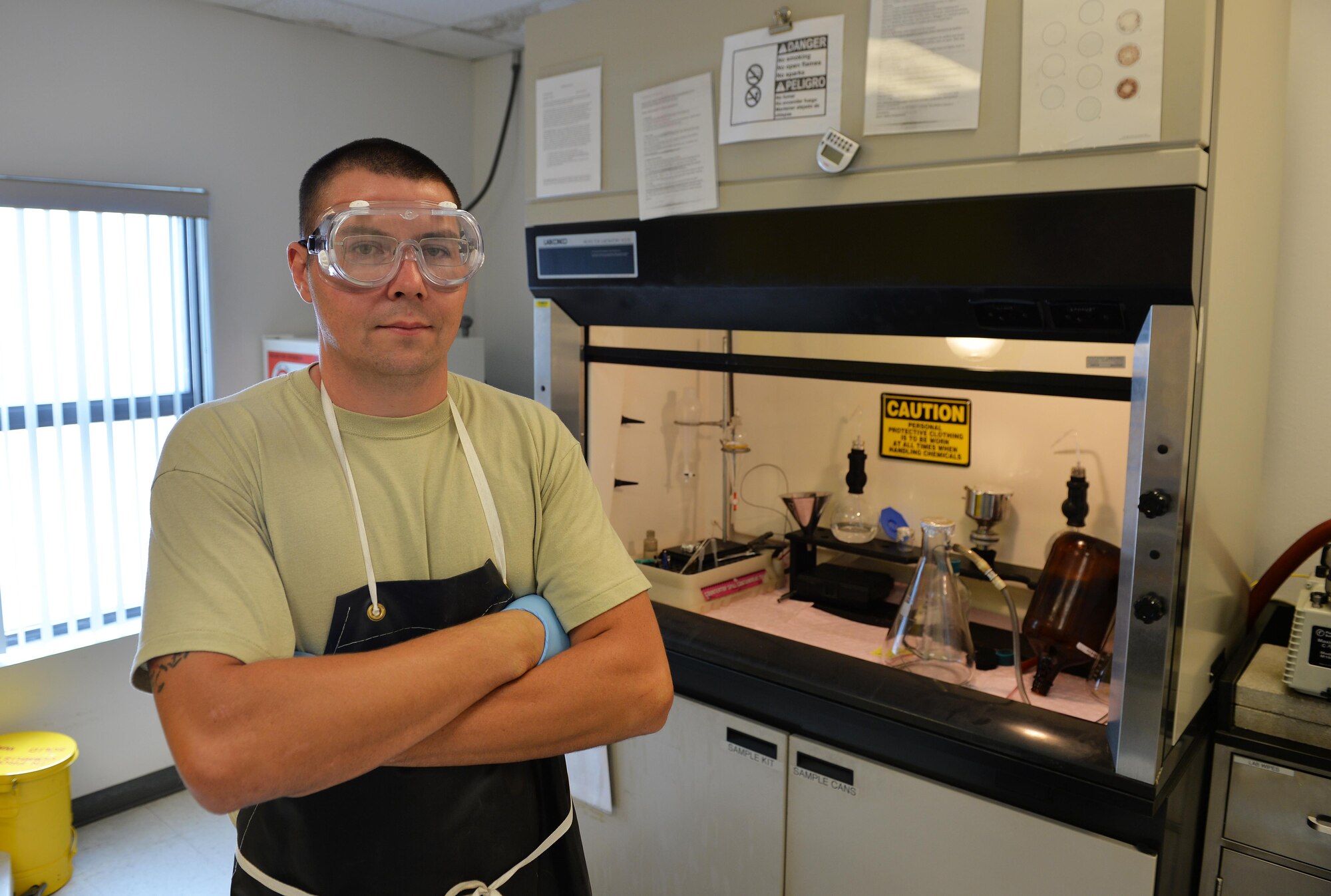Staff Sgt. Timothy Andrews, NCO in charge of the fuels lab for the 1st Special Operations Logistics Readiness Squadron, stands with fuel testing equipment at Hurlburt Field, Fla., Oct. 25, 2016. Fuel specialists test petroleum samples from aircraft, vehicles and storage facilities. (U.S. Air Force photo by Senior Airman Andrea Posey)