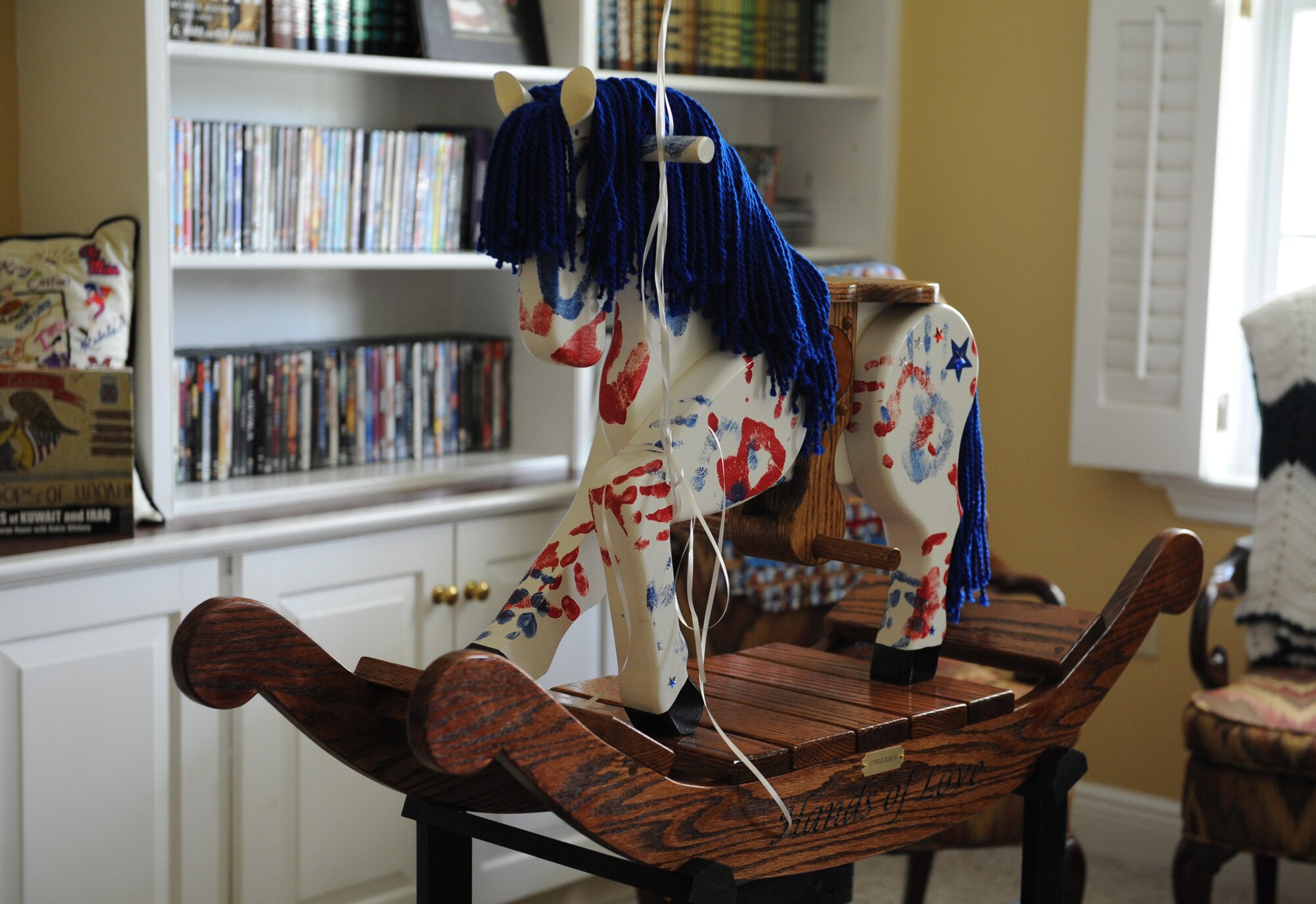 A “Patriotic Pony” sits on display at the Keesler Fisher House during a dedication ceremony Oct. 24, 2016, on Keesler Air Force Base, Miss. Hero’s Rock, a non-profit organization, dedicated the handmade pony to the Fisher House in memory of 1st Lt. Michael Blassie, Jr., who was killed in action in Vietnam May 11, 1972. Since Sept. 1, 2016, Hero’s Rock delivered 18 “Patriotic Ponies” to 12 Fisher House locations; with Keesler being the final stop. The group created each pony in memory of a military member killed in action. (U.S. Air Force photo by Kemberly Groue/Released) 