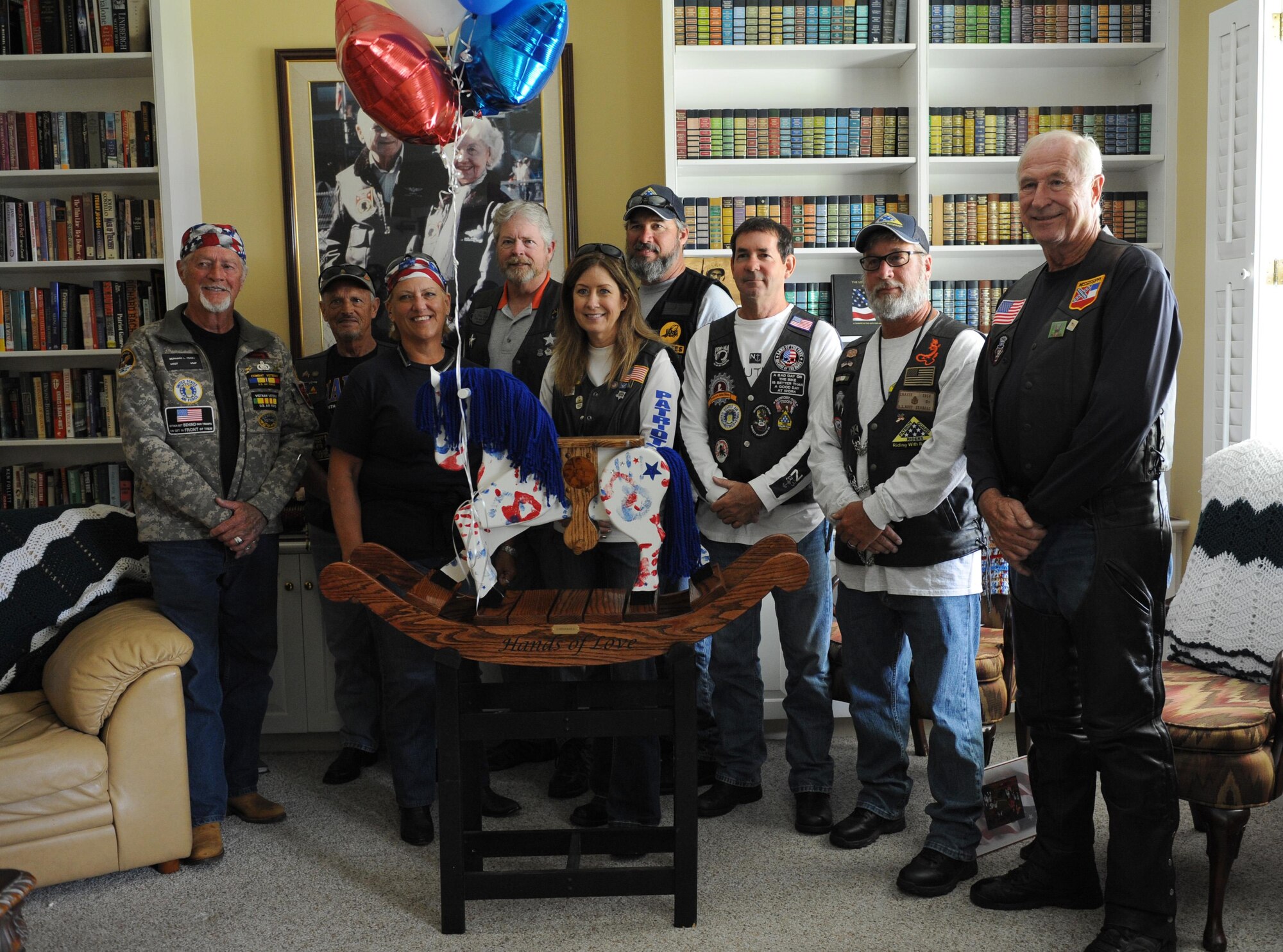 Members of the Patriot Guard Riders of the Gulf Coast pose for a photo with a “Patriotic Pony” at the Keesler Fisher House during a dedication ceremony Oct. 24, 2016, on Keesler Air Force Base, Miss. Hero’s Rock, a non-profit organization, dedicated the handmade pony in memory of 1st Lt. Michael Blassie, Jr., who was killed in action in Vietnam May 11, 1972. Since Sept. 1, 2016, Hero’s Rock delivered 18 “Patriotic Ponies” to 12 Fisher House locations; with Keesler being the final stop. The group created each pony in memory of a military member killed in action.  (U.S. Air Force photo by Kemberly Groue/Released) 