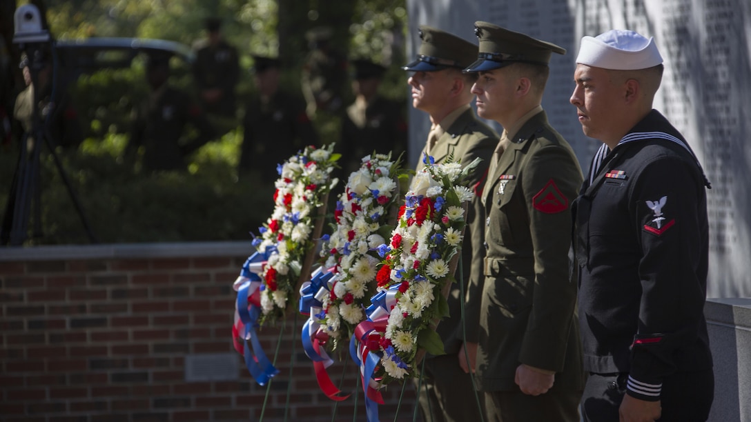 U.S. service members stand at attention during the 33rd Beirut Memorial Observance Ceremony, Lejeune Memorial Gardens, Jacksonville, N.C., Oct. 23, 2016. A memorial observance is held October 23rd of each year to remember those lives lost during the terrorist attack at U.S. Marine Barracks, Beirut, Lebanon, in 1983.