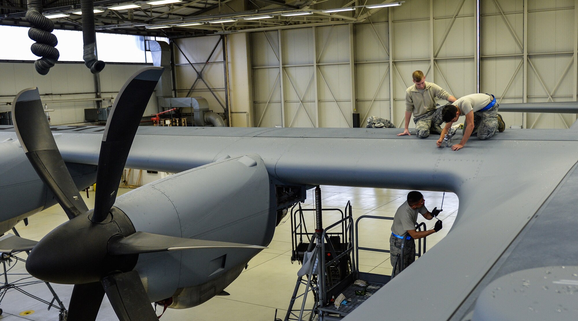 Airmen from the 86th Aircraft Maintenance Squadron remove the wing leading edge to facilitate structural repair on a C-130J Super Hercules wing at Ramstein Air Base, Germany, Oct. 25, 2016. Crew chiefs and aircraft electrical and environmental specialists often work together to repair and troubleshoot aircraft. (U.S. Air Force photo by Senior Airman Nesha Humes)