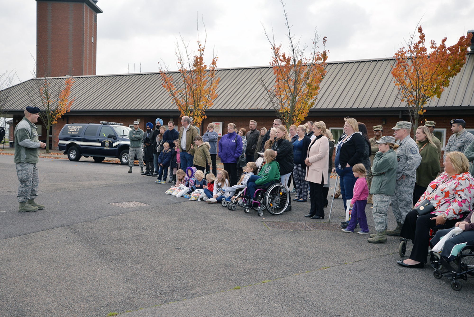 U.S. Air Force Tech. Sgt. Samuel Giordano, left, 100th Security Forces Squadron Military Working Dog kennel master, talks to participants of the Steel Bones event after a military working dog display Oct. 24, 2016, on RAF Mildenhall, England. Steel Bones is a local British organization similar to the Wounded Warrior Program, specifically aimed at amputees and their families. (U.S. Air Force photo by Karen Abeyasekere)