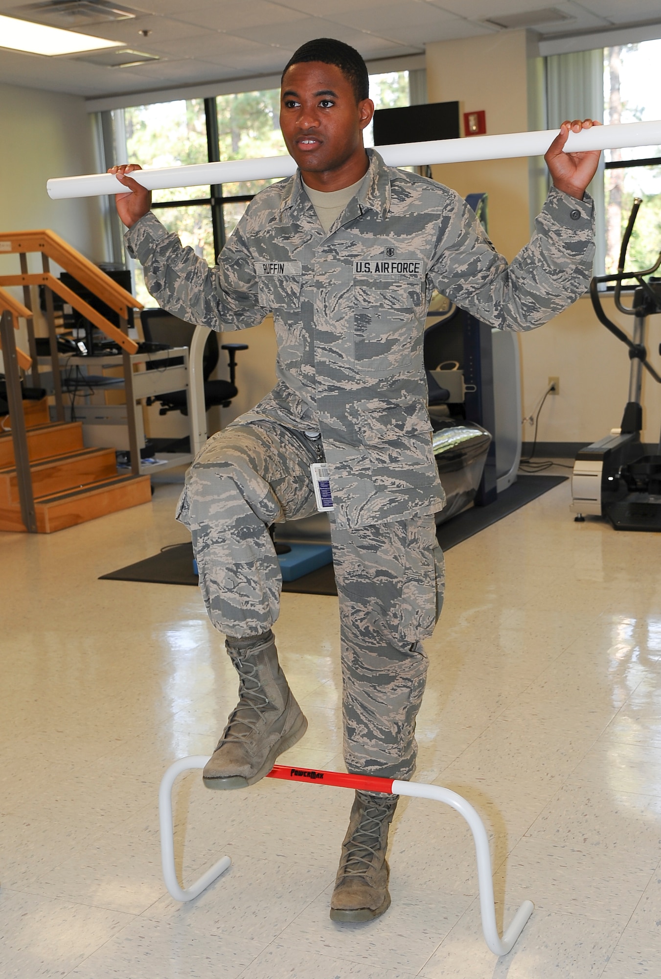 Sr Airman Derrick Ruffin, 78th Medical Group pharmacy technician, tries his strength during the Physical Therapy open house, Oct 26, 2016. To observe the National Physical Therapy month, 78th Med Group hosted an open house on the second floor of the Medical Group facility. (U.S. Air Force photo by Misuzu Allen)