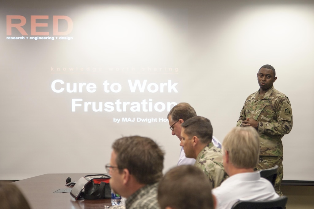 ST. PAUL, Minn. - Maj. Dwight Howell, St. Paul District quality and knowledge manager, presents the inaugural RED talk at the district's headquarters in St. Paul, Minn., Oct. 19. The RED talks, short for research, engineering and design, are designed to create a culture of sharing information within the organization.