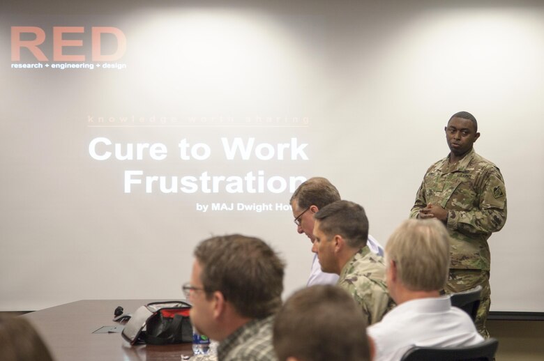 ST. PAUL, Minn. - Maj. Dwight Howell, St. Paul District quality and knowledge manager, presents the inaugural RED talk at the district's headquarters in St. Paul, Minn., Oct. 19. The RED talks, short for research, engineering and design, are designed to create a culture of sharing information within the organization.