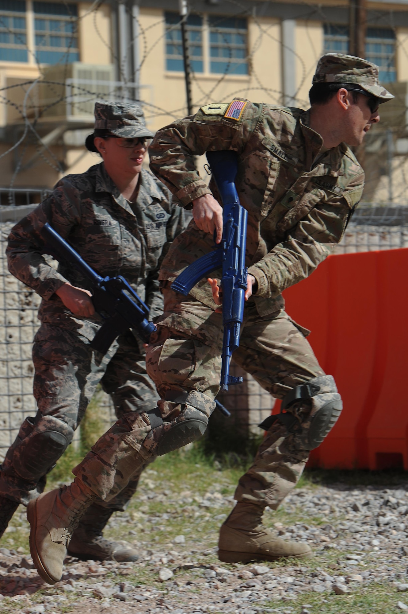 Participants of the Operational Contract Support Joint Exercise 2016 practice a tactical withdrawl during the tactical combat casualty care training, March 24, 2016, at Fort Bliss, Texas. OCSJX-16 provides training across the spectrum of OCS readiness from requirements and development of warfighter staff integration and synchronization through contract execution supporting the joint force commander. (U.S. Air Force Photo by Tech. Sgt. Chad Chisholm/Released)
